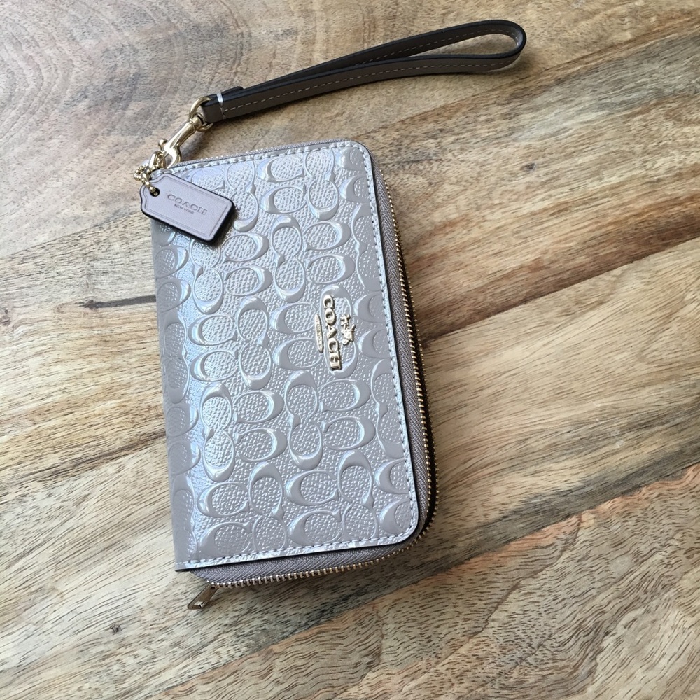 Coach nude embossed wristlet